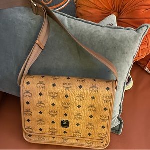 MCM Messenger bag.  Gently used / In good condition.   Tiny scar on buckle.